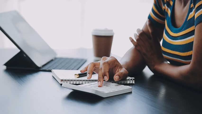 Portrait of Asian young female working on laptop at office