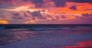 Beach park sunset landscape view Sunset at sea Dramatic sky sunset over sea Sea wave rolling foamy come in sand beach Sea beach sunset high quality video 4K