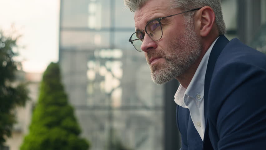 Close up sad upset worried frustrated stress pensive senior business man sorrowful thoughtful middle-aged old mature businessman employer take off glasses think problem solution thinking city outdoors Royalty-Free Stock Footage #1105780623