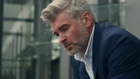 Close up sad upset worried frustrated stress pensive senior business man sorrowful thoughtful middle-aged old mature businessman employer take off glasses think problem solution thinking city outdoors - Powered by Shutterstock - Get 15% off with code: PIKWIZARD15