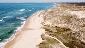 Rocky Algarvian coast in the southwestern part of Portugal. Waves of the Atlantic Ocean crashing against the rocks. Fabulous scenery. 4k video
