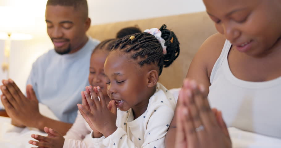 Black family, parents and children praying in bed for religion, worship God and faith at night. Spiritual, Christian and mother, father and girls in prayer for faith, gratitude and hope in bedroom Royalty-Free Stock Footage #1105789209