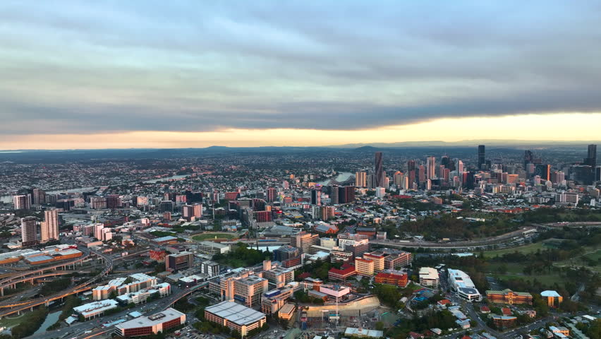 Wide Rotating Drone Shot Of Brisbane City Cloudy Sky At Dusk, a Buildings & Landmark Video by Tempus Media