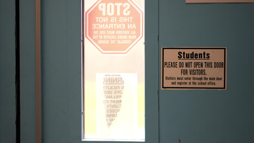 Sign posted at entrance for students security and safety at school saying that all visitors must report to the office for entrance.