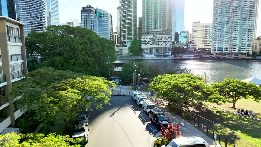 Panning Up Drone Shot Revealing Brisbane River And City Buildings