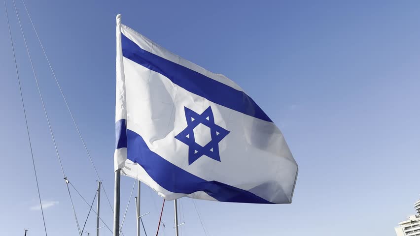 Israeli flag white and blue with star Magen David fluttering in wind on blue sky. outdoor.  Royalty-Free Stock Footage #1105803419