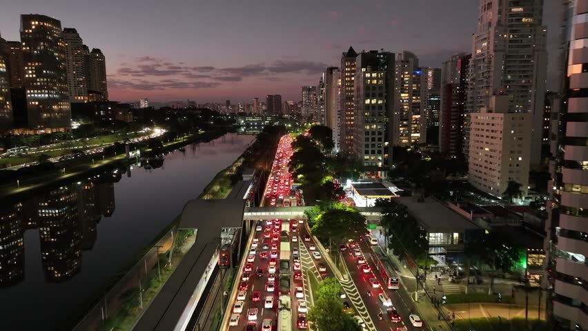 Time Lapse Traffic At Sunset City Sao Paulo Brazil. Timelapse Sunset City Sao Paulo. Sunset Sky Clouds Downtown Cityscape. Sunset Exterior Downtown District Panning Wide. Royalty-Free Stock Footage #1105811483