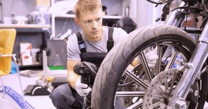 Master man checks tire pressure in motorcycle 4k movie