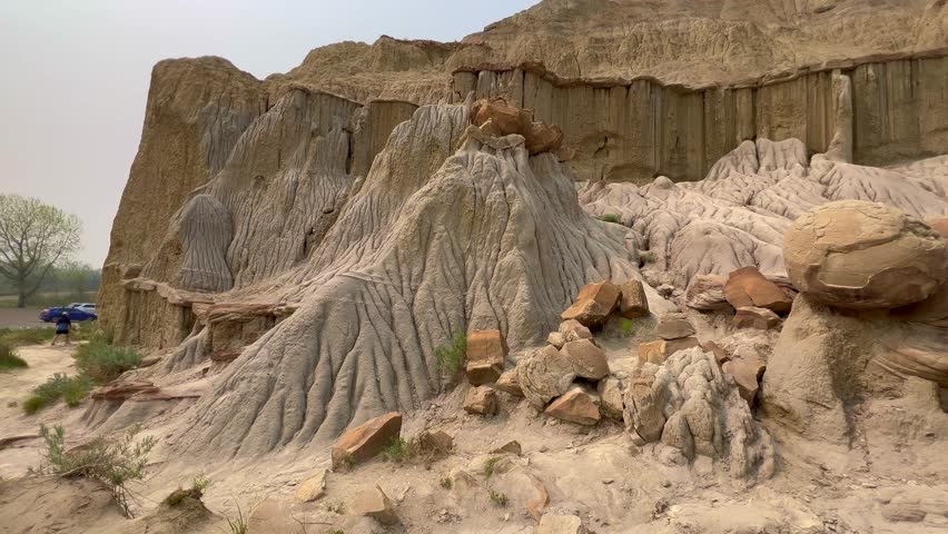 Panning Left on the badlands hills and mountains in the Cannonballs area in the North Unit in  Theodore Roosevelt National Park in North Dakota.