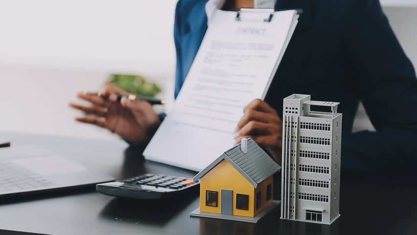 Real estate agent and customer signing contract to buy house, insurance or loan real estate.rent a house,get insurance or loan real estate or property.

 Royalty-Free Stock Footage #1105816073
