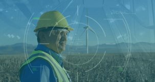 Animation of financial data processing over caucasian engineer and wind turbine. Global wind energy, sustainability, business, computing and data processing concept digitally generated video.