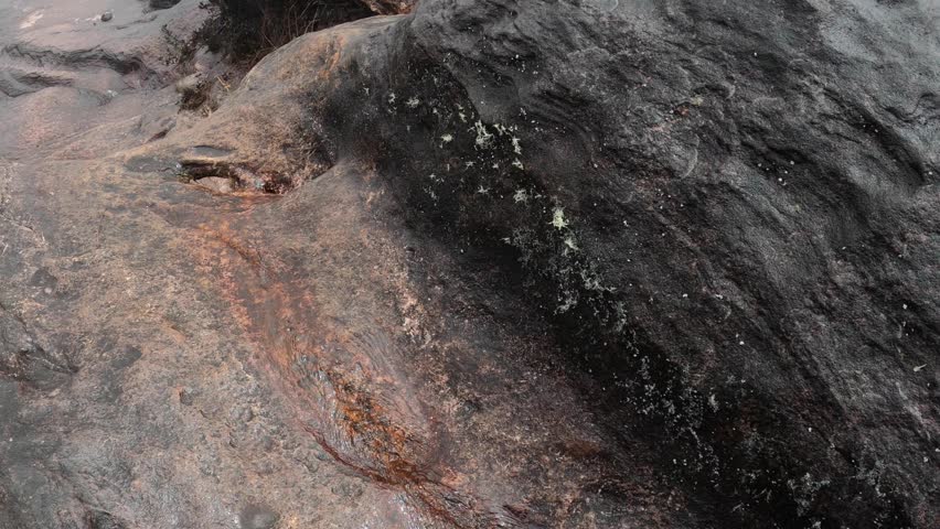 Rainwater washed out a hole in boulder on top of Mount Roraima, top and bottom view, Canaima national park, Venezuela