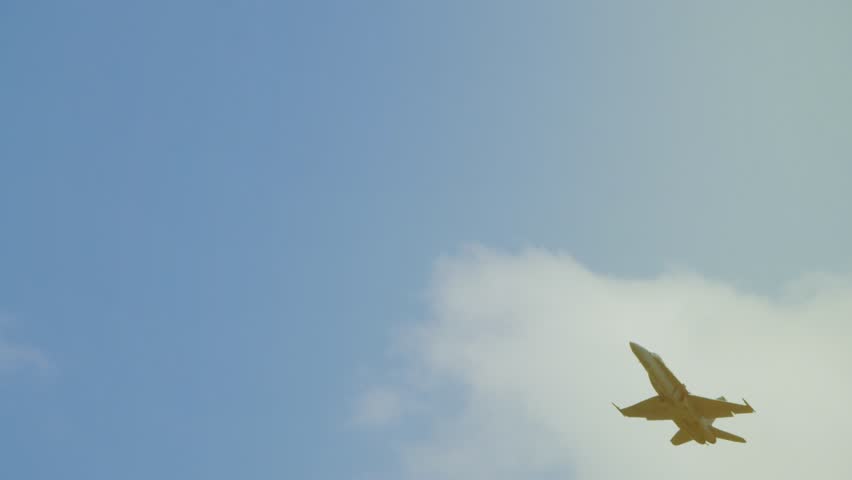 Combat aircraft flies in the sky. Aviation completes the mission. Fighter with missiles on board
