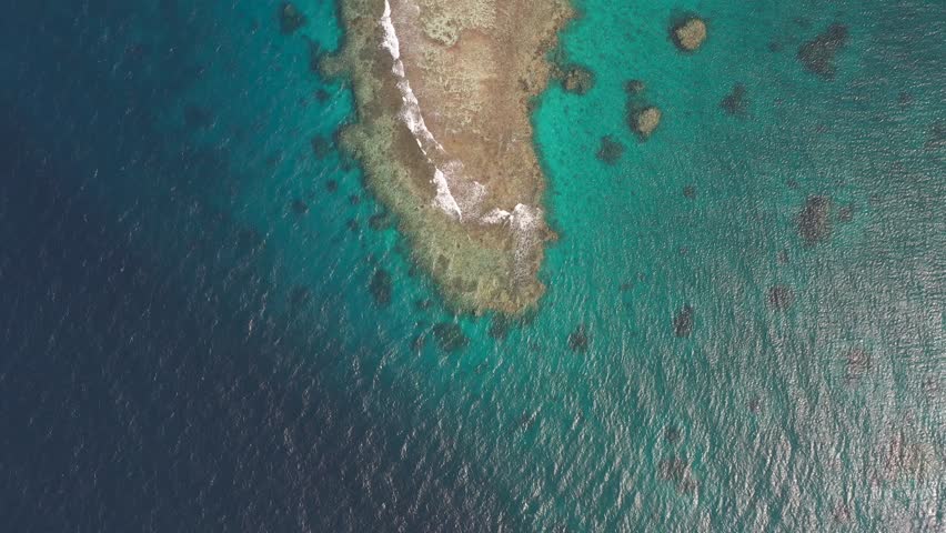 Waves break over reef crest of coral, red sea Jeddah saudi arabia, aerial top down Royalty-Free Stock Footage #1105822465