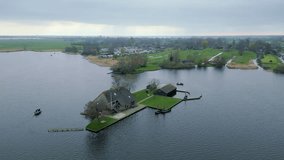 Giethoorn village - Venice of the Netherlands. Flying around the house in the middle of the lake