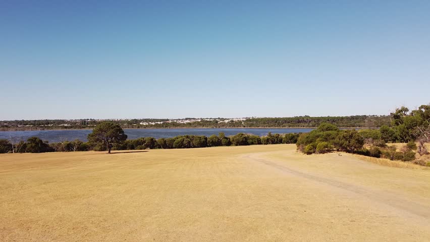Aerial footage flying towards lake Joondalup in Perth Western Australia