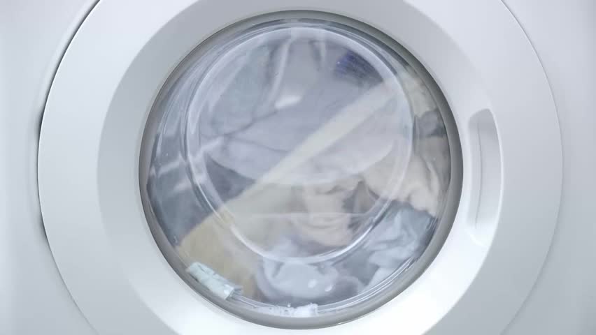 Close up white washing machine working with laundry, washing clothes and sheets, view porthole, close up, front view Royalty-Free Stock Footage #1105826717