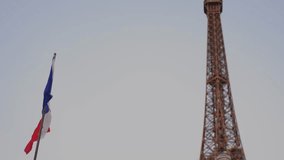 Eiffel Tower with a French flag on bright background.  - Powered by Shutterstock - Get 15% off with code: PIKWIZARD15
