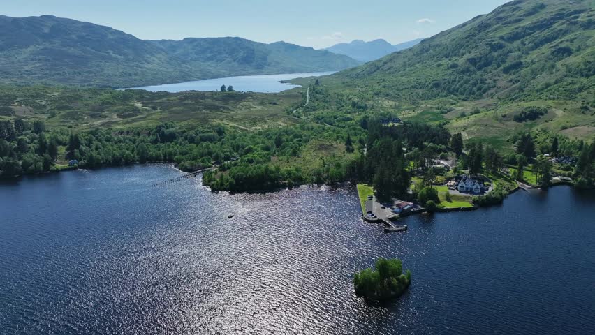 Aerial Footage of Loch Katrine in The Trossachs National Park in The Scottish Highlands, Scotland during summer