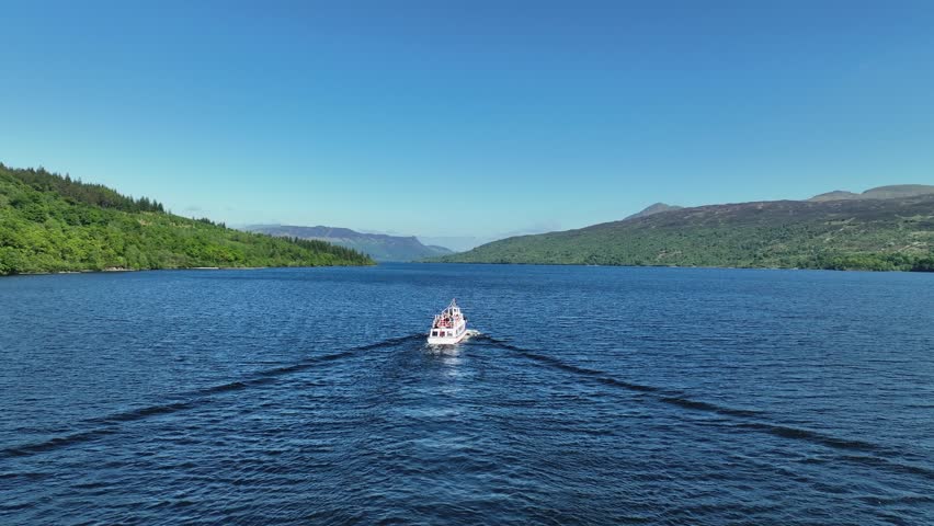 Aerial Footage of Boat Cruise on Loch Katrine in The Trossachs Area of the Scottish Highlands, Scotland on Hot Summers Day