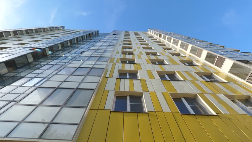 white and yellow facade of new modern multi-storey house, bottom view, close-up Royalty-Free Stock Footage #1105832901