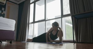 Woman doing exercise at apartment