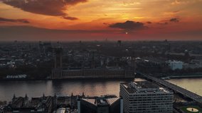Establishing Aerial View Shot of London UK, United Kingdom, Westminster, Elizabeth Tower, British Parliament, Big Ben, epic sunset, slow circling left