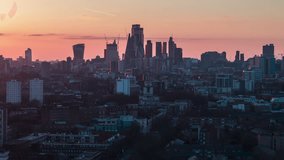 Square Mile, City of London, Establishing Aerial View Shot of London UK, United Kingdom, circling left, superb soft sunset light