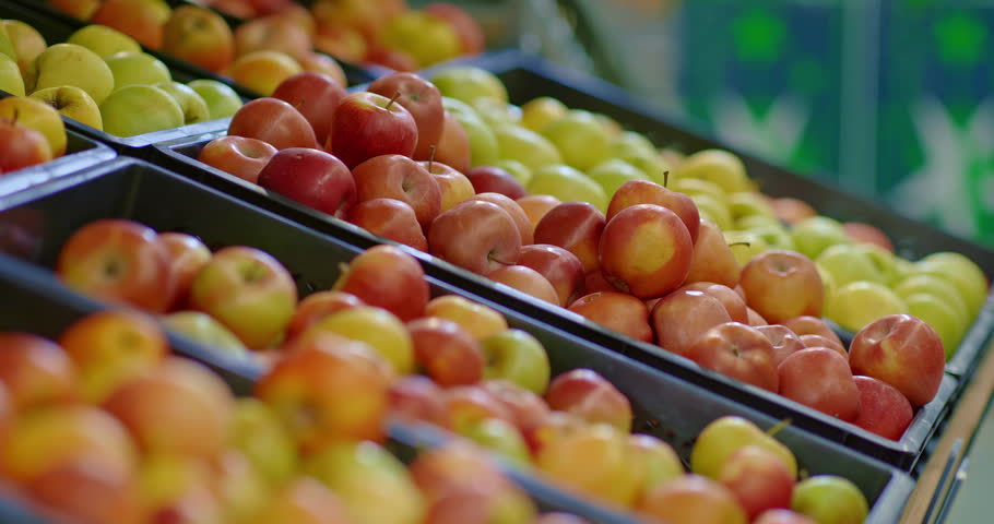 customer taking apples from counter in grocery store, closeup of fruits and hand, 4K, Prores
