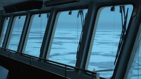 Vessel. View from navigation bridge. Frozen sea outside. Big windows in wheelhouse. Ship in ice. - Powered by Shutterstock - Get 15% off with code: PIKWIZARD15
