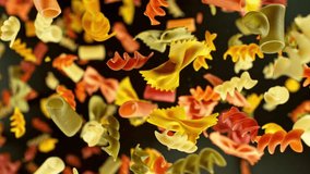 Super slow motion of flying uncooked Italian pasta mix on black background. Filmed on high speed cinema camera, 1000 fps, placed on high speed cine bot, following the object. Speed ramp effect. - Powered by Shutterstock - Get 15% off with code: PIKWIZARD15