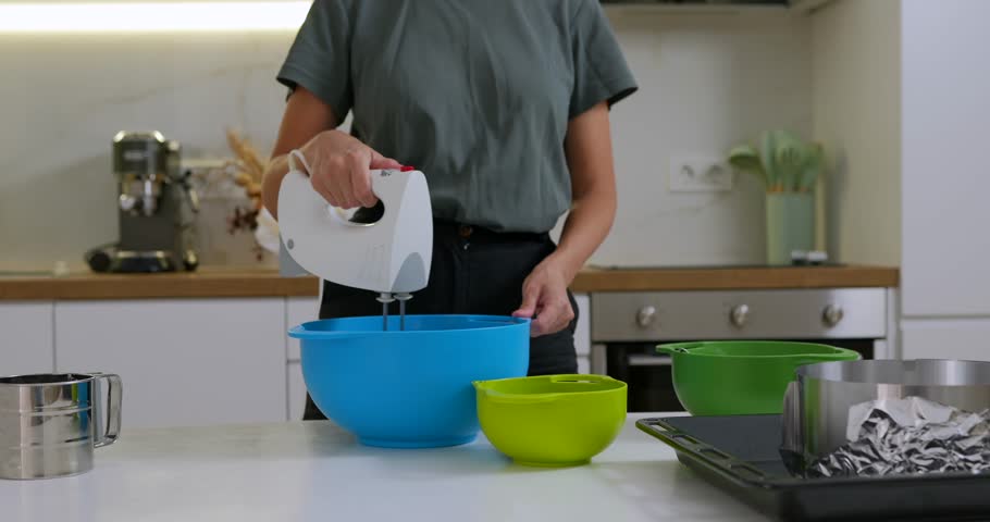 Woman mixing spinach with dough for healthy bakery, top view