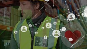 Animation of connected profile icons, graphs, heart shape over diverse workers talking in warehouse. Digital composite, social media, networking, technology, teamwork, shipping and logistics. - Powered by Shutterstock - Get 15% off with code: PIKWIZARD15