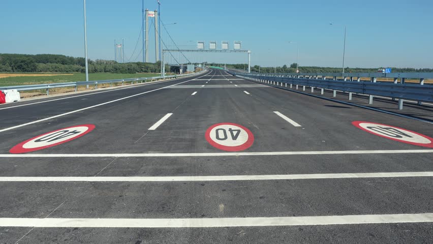 Wide angle pan camera movement 4K video with the suspension bridge in Braila, Romania. The third longest suspended bridge in Europe. Infrastructure industry in Romania.