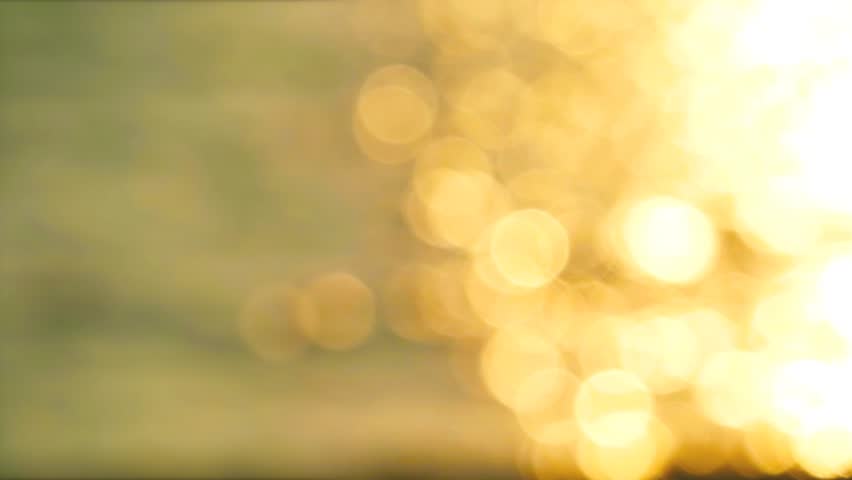 blur reflection medium glitter sunset light on water surface of the sea on the evening