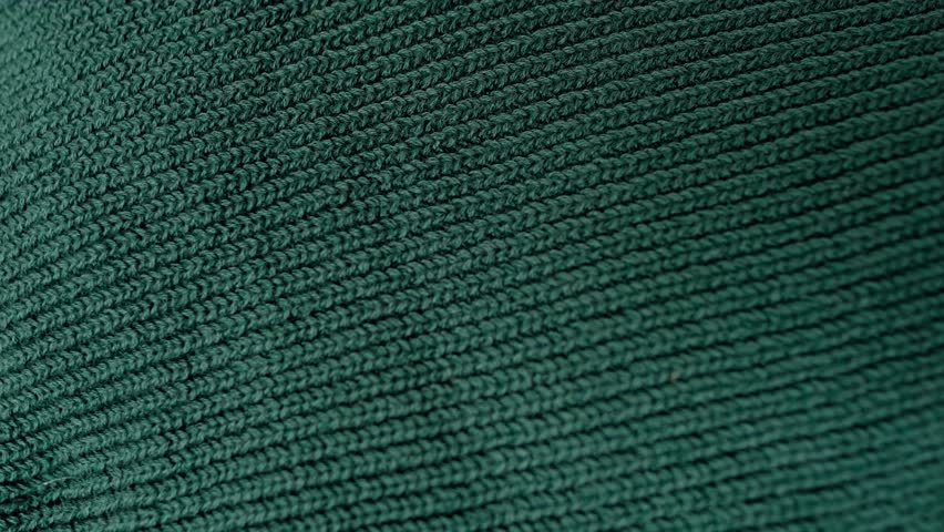 knitted jersey, embossed canvas, green wool yarn, knitted texture, concept of warm things for cold weather, check quality, fashionable clothes, clothing production Royalty-Free Stock Footage #1105861099