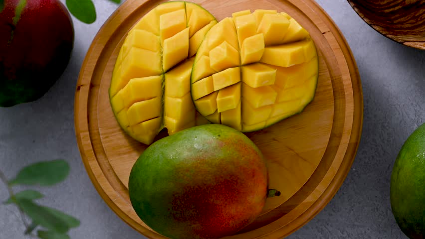 Fresh mango slow motion. Delicious, juicy sliced mango fruit. Royalty-Free Stock Footage #1105862031
