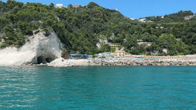 SIROLO, ITALY - JULY 3, 2023: Summer view of Urbani beach in the park of Mount Conero, Sirolo, Marche region, Italy