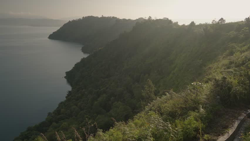 Danau Toba view from Tarabunga Hill - a Large Natural Lake in North Sumatra, Indonesia, Occupying The Caldera of a Supervolcano Royalty-Free Stock Footage #1105865689