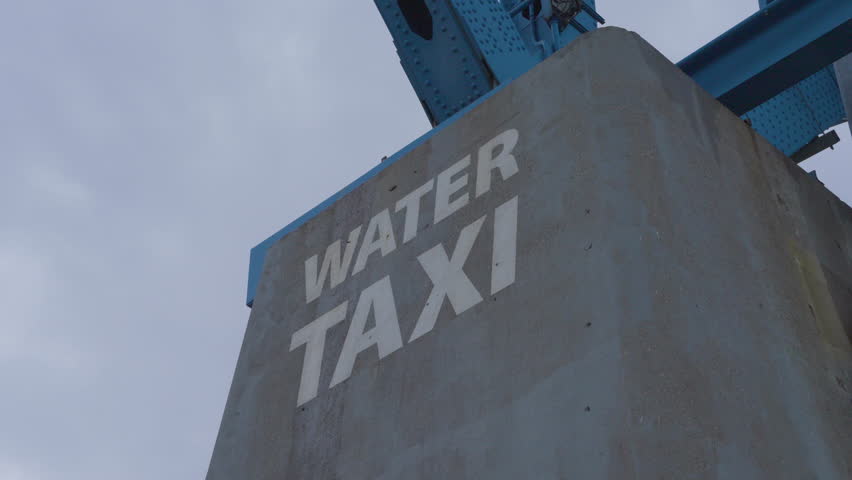 water taxi sign on pier of bridge in Cleveland Ohio flats