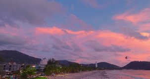 Aerial view exotic pink sky in sunset above Patong beach Phuket.
Scene of colorful romantic sky sunset with brilliant pink sky. 
beautiful sky of sunset in nature and travel concept. 