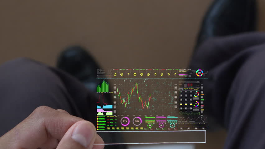 A men using digital tablet for analyze a stock market exchange. Business data number futuristic hologram background. | Shutterstock HD Video #1105882409