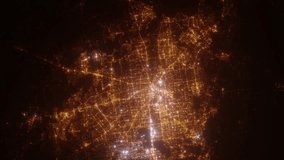 Houston (Texas, USA) top view at night. View on modern city from satellite. Camera is zooming in, rotating counterclockwise. Vertical video. The north is on the left side