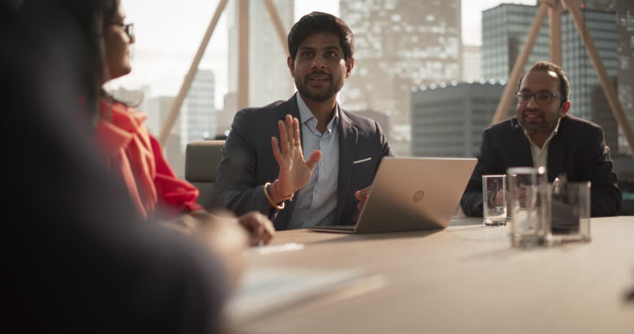 Portrait of a Young Successful Director Making a Report to a Board of Directors During an Annual Financial Meeting in the Conference Room. Business People and Partners Discussing Work in an Office Royalty-Free Stock Footage #1105891445