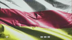 VHS video casette record South Ossetia flag waving on the wind. Glitch noise with time counter recording banner swaying on the breeze. Seamless loop.
