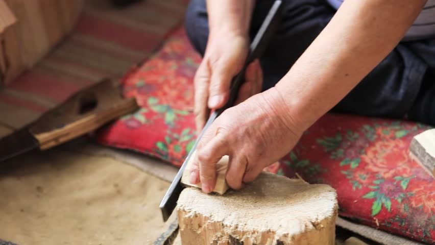 An experienced craftsman makes a saddle