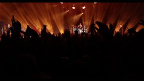 Cheering people crowd on the dance floor during a music concert. - Powered by Shutterstock - Get 15% off with code: PIKWIZARD15
