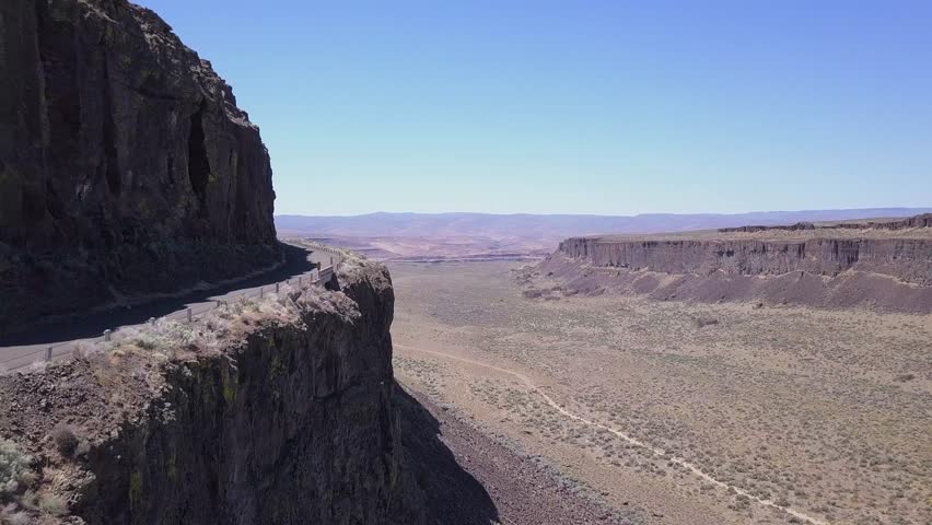 Cliff aerial: Road carved into rock wall of Frenchman Coulee, WA state