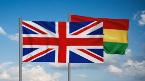 Ghana flag and United Kingdom, UK flag waving together on blue sky, looped video, two country cooperation concept