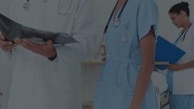 Animation of network of connections with icons over diverse doctors. Global medicine, healthcare services, connections, computing and data processing concept digitally generated video. - Powered by Shutterstock - Get 15% off with code: PIKWIZARD15